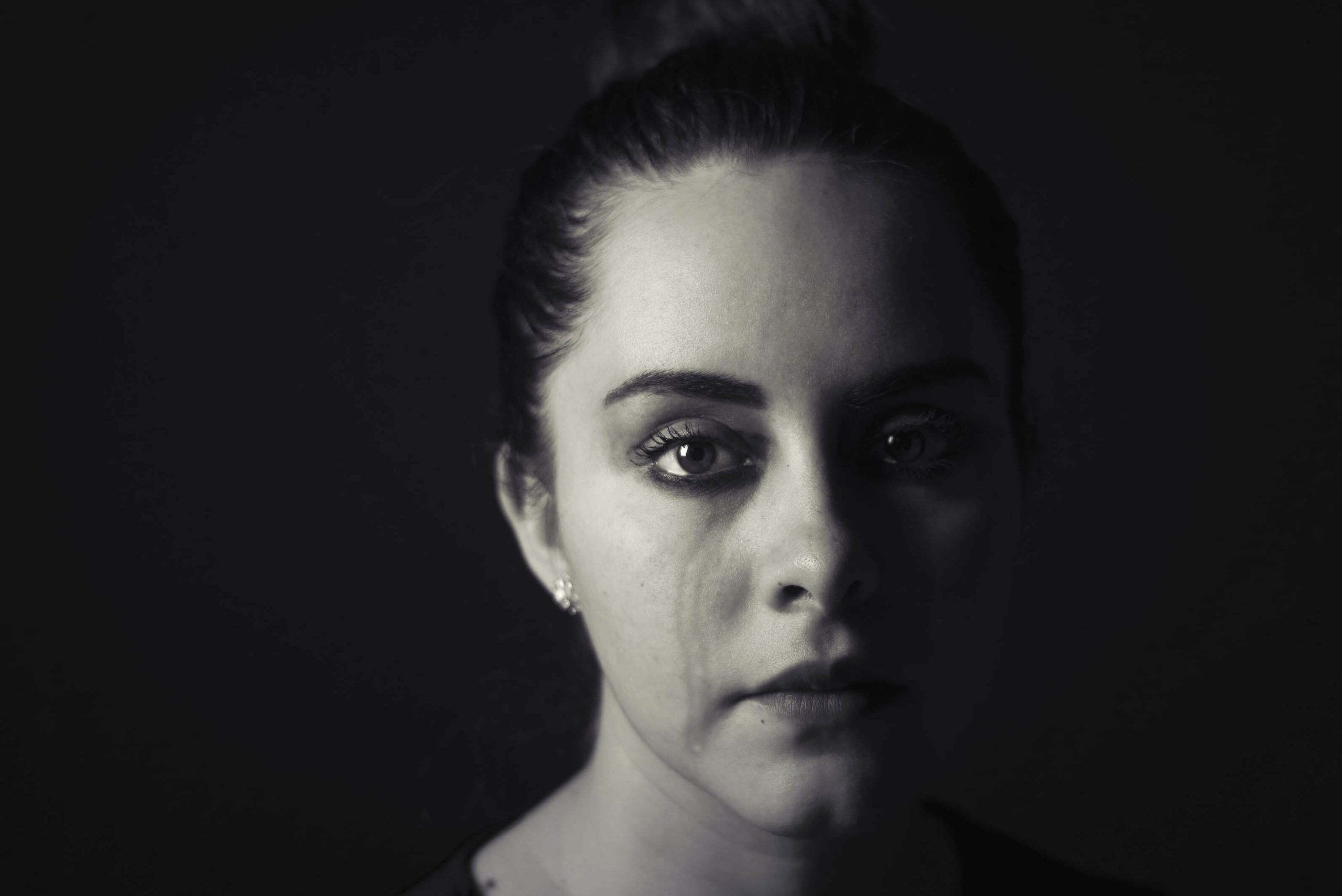 A person sitting quietly, unseen