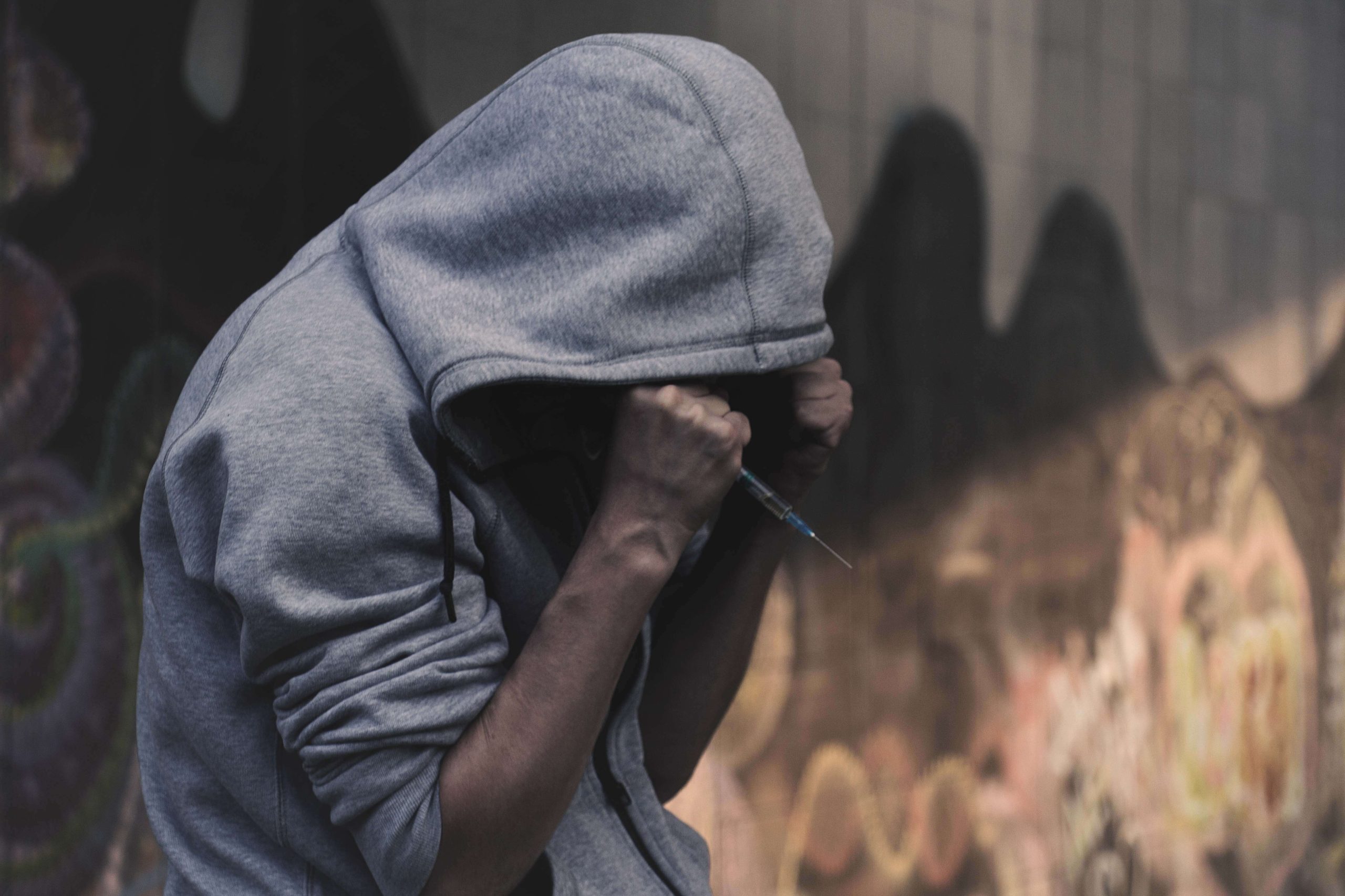 A person alone with addiction — Grace is a Christian AI companion for every stage of the journey