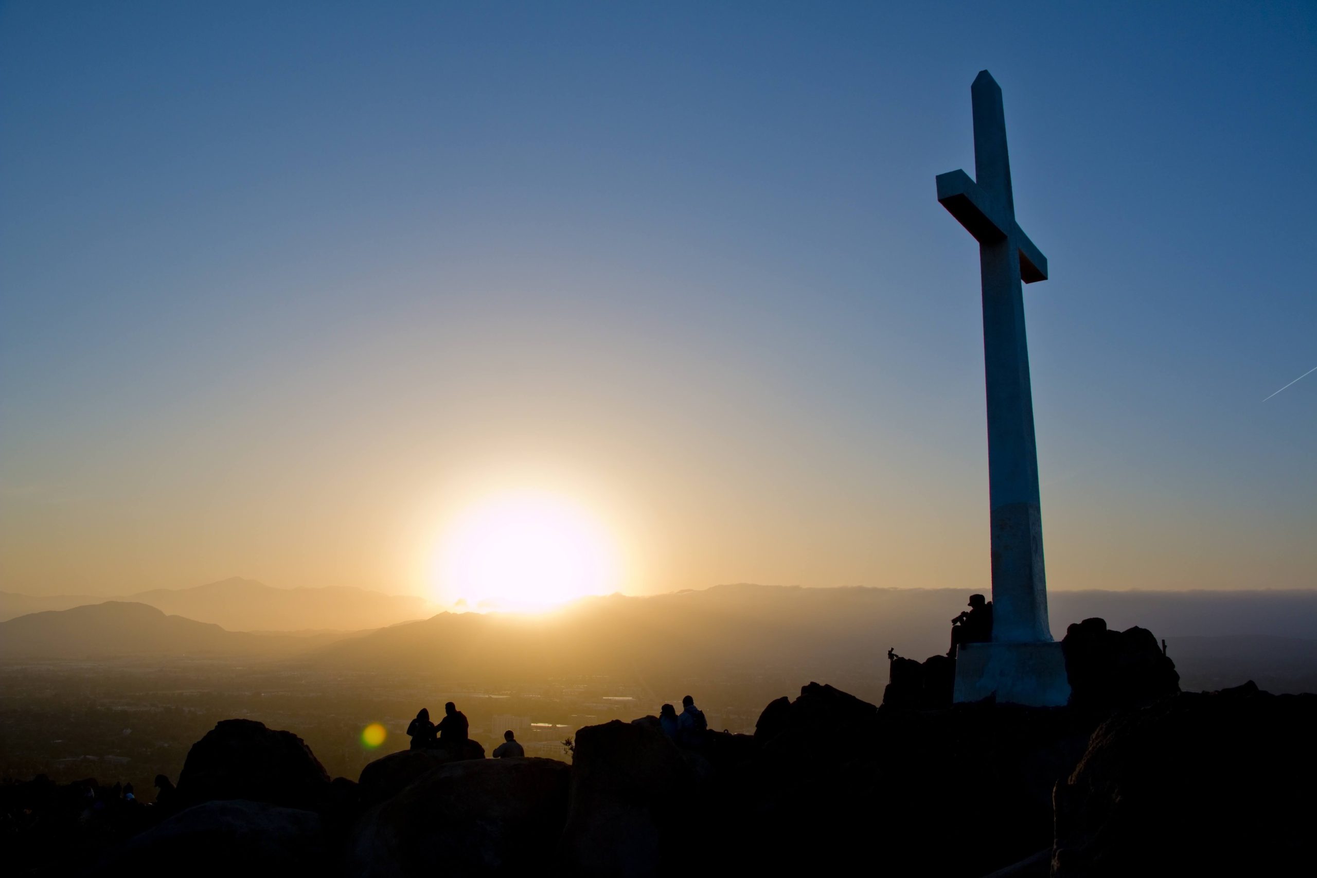 Cross at sunrise — the foundation of Christian AI companionship